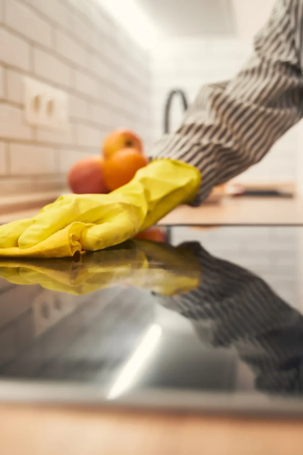 close-up-of-female-hand-that-cleaning-oven-2026-01-09-01-10-08-utc